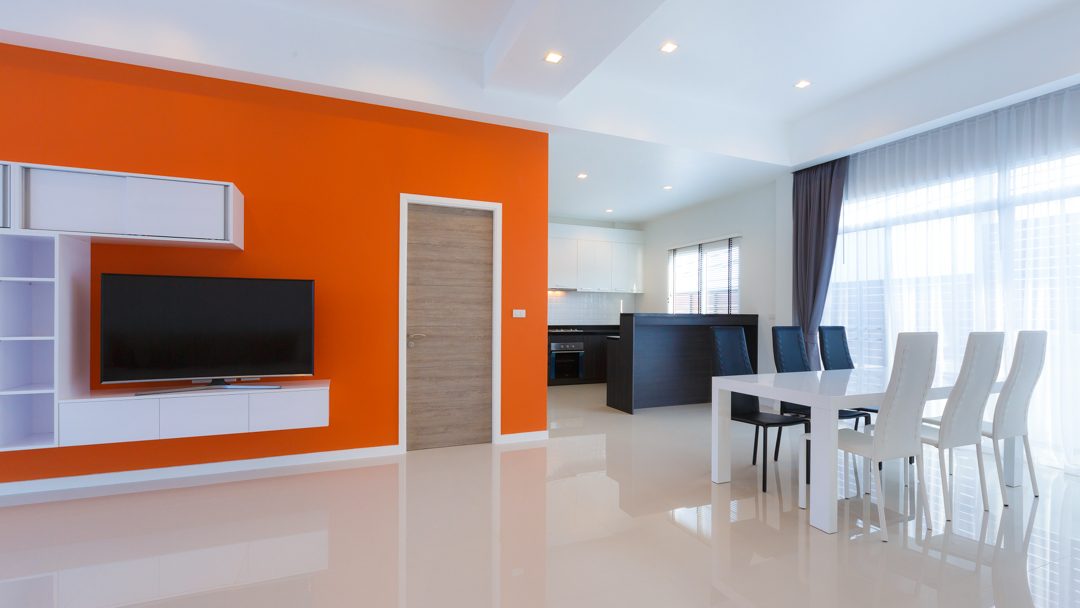 Dining table with the open kitchen behind